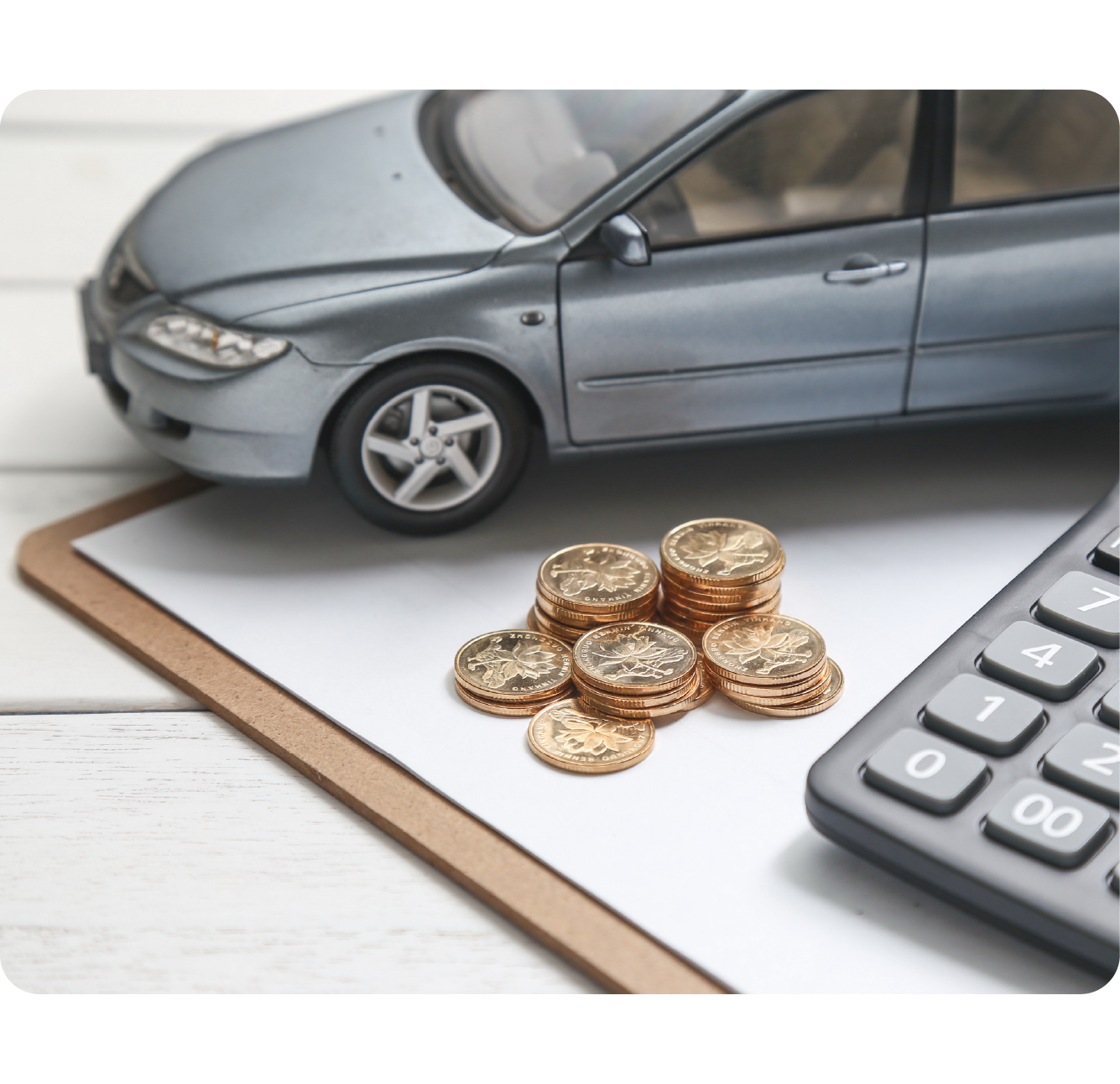 Person with a backpack on holding a drawing of a car