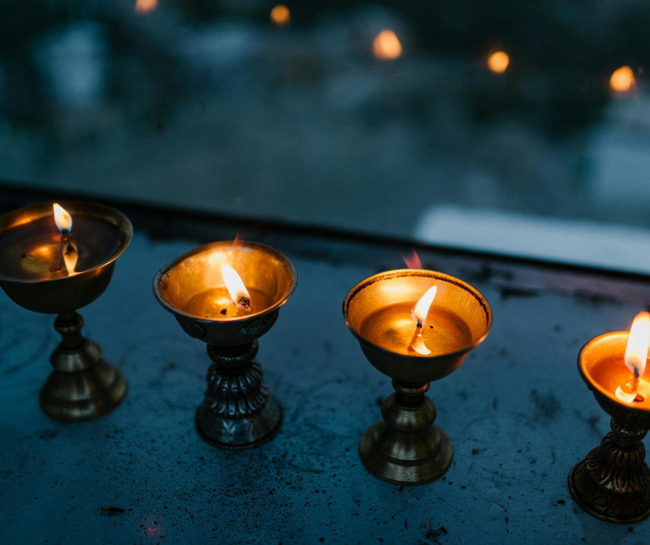 Lit candles on a ledge of a building for Diwali.